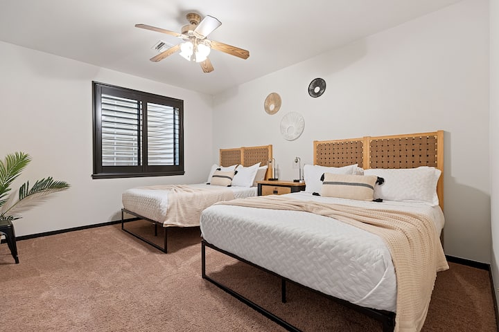 Basement double queen bedroom with walk-in closet and luggage racks available