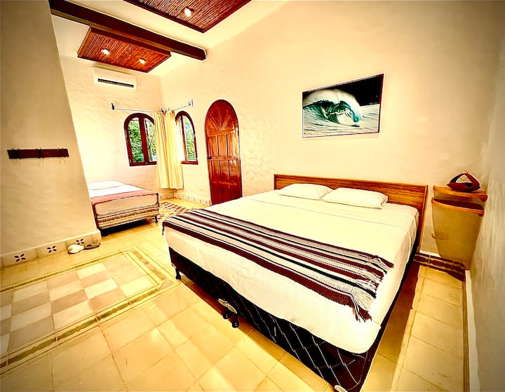 Room 7 is located upstairs and adjoins the common area balcony with room #8.