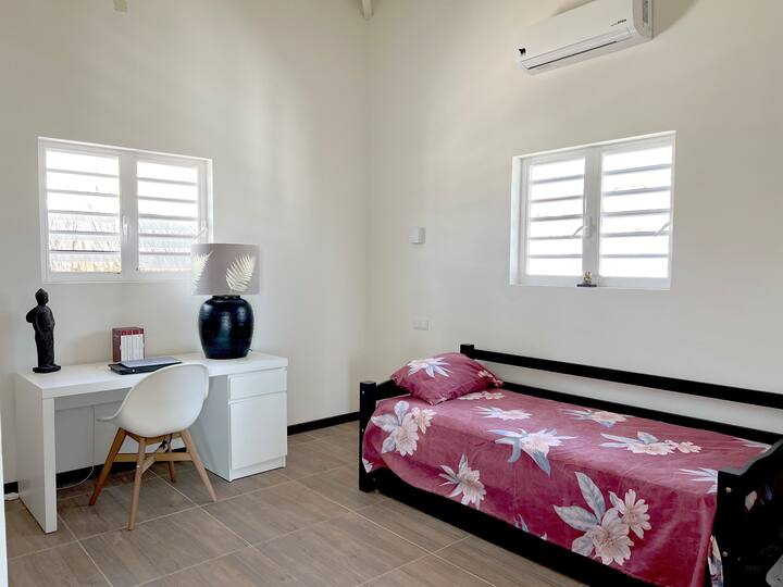 The bottom of the bed slides out to form two twin-sized beds