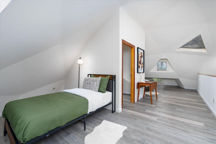 Loft area / upper level has 2 single beds