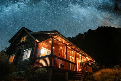 Natural log house nestled in the serene mountains