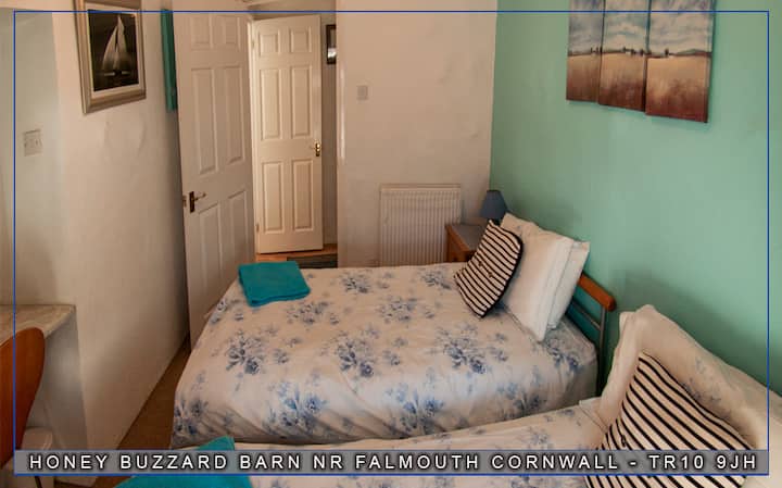 The Twin Bedroom, two single beds either together or apart, fitted wardrobe and 1 full length window.