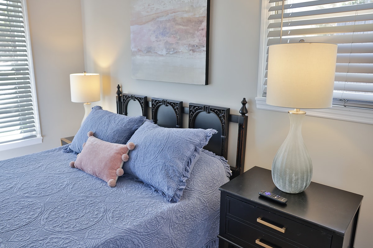 Bedroom 3 with a Queen bed, 2 night stands and a dresser with a 55 inch  Smart Tv