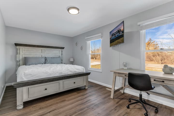 Master bedroom has a King size bed and plush linens.  We've also created a workspace away from the main living area in this cozy suite.   