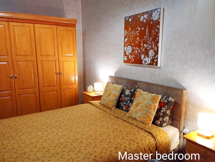 Master bedroom with a king size bed