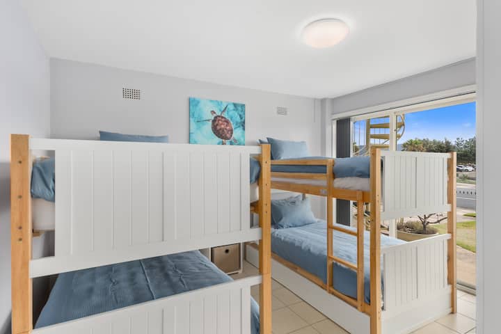 The second bedroom features two sets of bunk beds, perfect for those travelling in a group or with kids.
