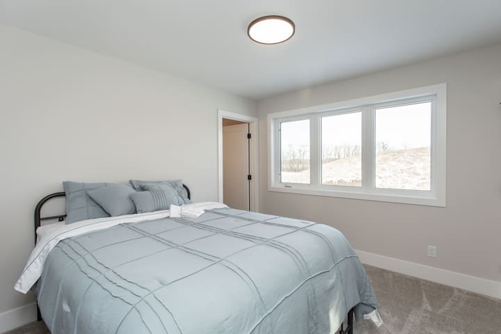 Upper queen room with a 1/2 bath (sink and toilet) ensuite.