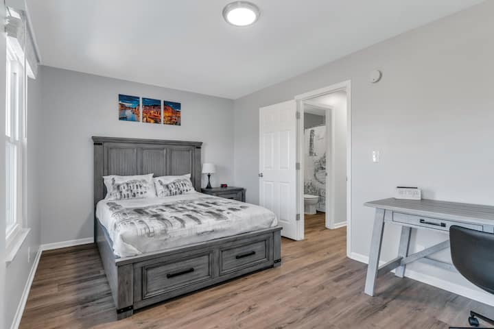 Main bedroom has a queen size bed and we've also created a workspace away from the main living areas in the cozy suite.