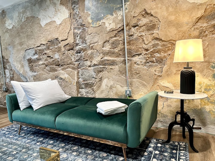 Rest comfortably with our loft's versatile futon! Located in downtown Stone Mountain Village, steps from dining and attractions. Experience history and modern comfort for a memorable stay.
