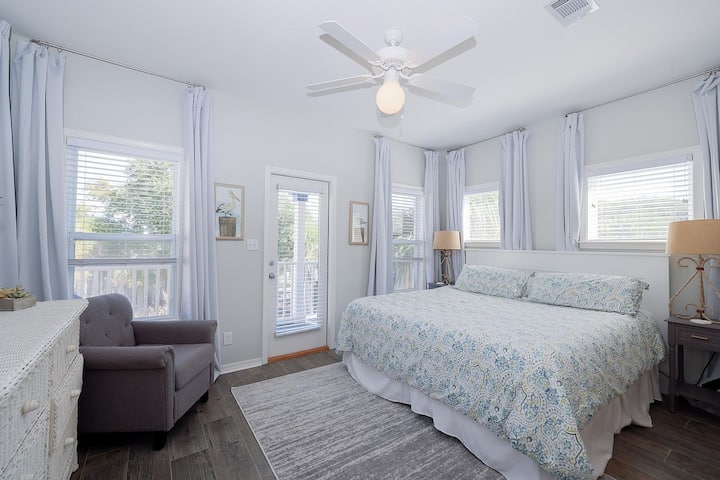 The spacious master bedroom features a newly remodeled bathroom with an 8-foot, dual rain heads, walk-in shower.  
There's plenty of cabinet space and we include a hair-dryer.  You also have a private balcony!