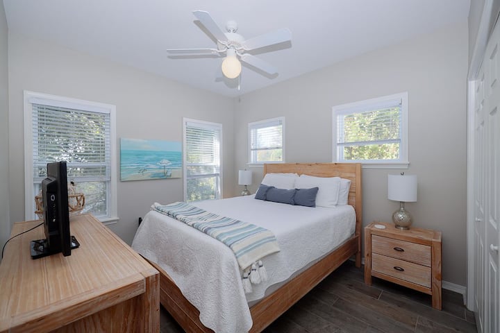 Our 2nd-floor guest bedroom features a queen bed, full closet, nightstands, USB charging block, and a new Smart TV so you can stream all your favorite shows after a day at the beach.