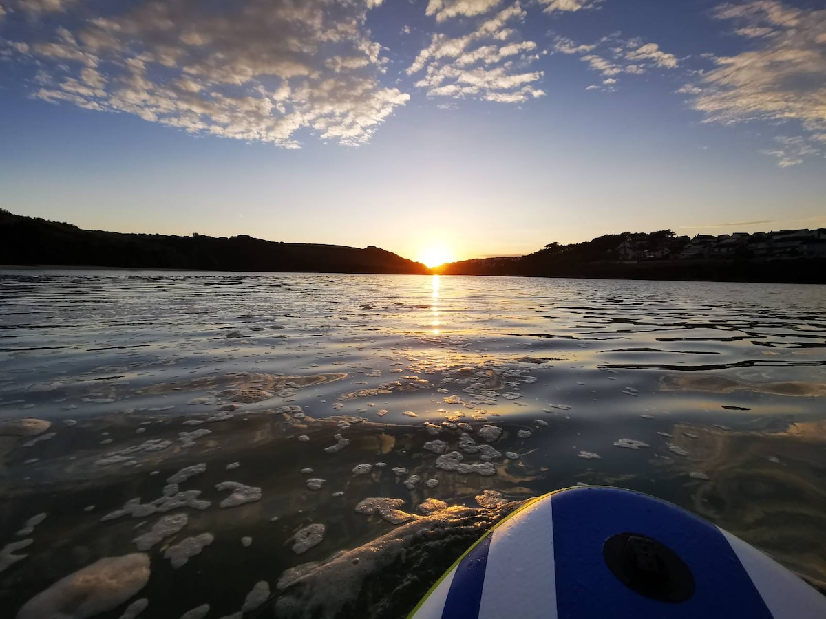 Stunning evening view Paddle Boarding at Newquay Gannel, heading towards Crantock.