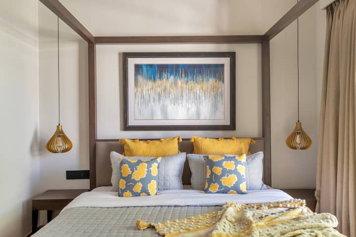 A cozy retreat: Bedroom with warm tones and an artistic touch.