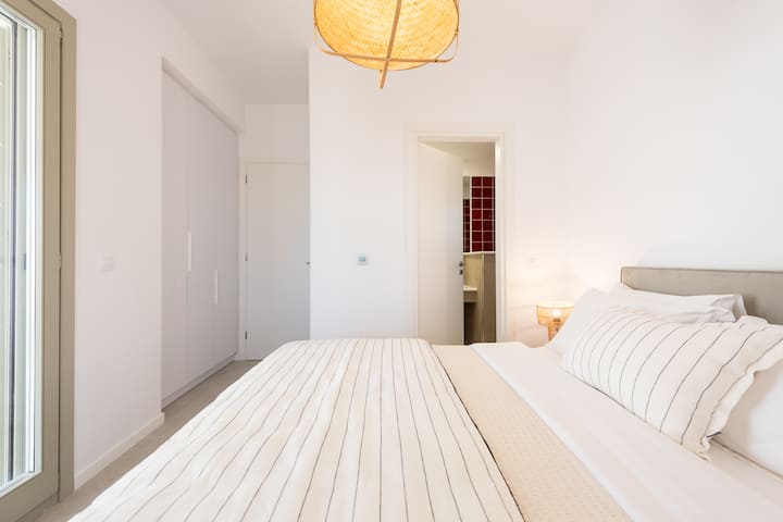 Master Bedroom of Triotissa B. Natural wooden furniture and a dubble size 160x200cm bed with independent springs adapt to the movements of the body. Cozy lighting, ecologic aircondition with automatic  turn off system. Capture 2