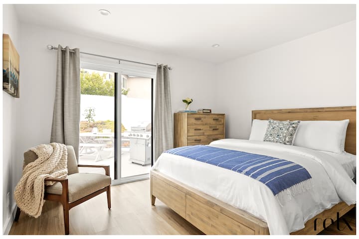 Main level bedroom with King bed,  direct access to our back patio through private sliding glass doors.  Accessible with no stairs.