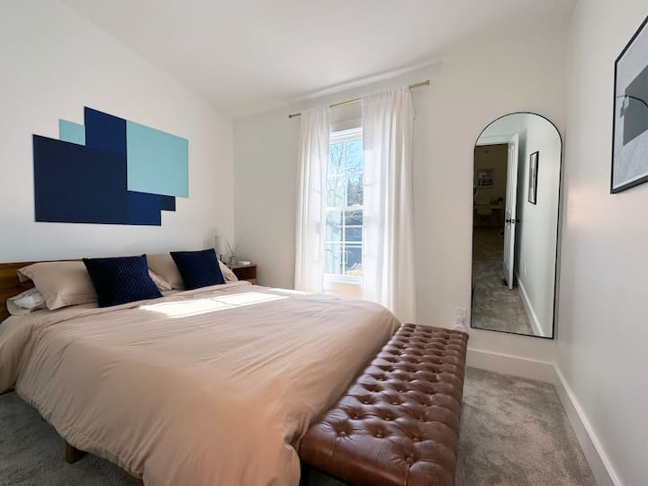 Queen bedroom queen bed. Nightstand + power bank for phone charging cords.