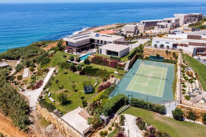 Beachfront house with tennis court
