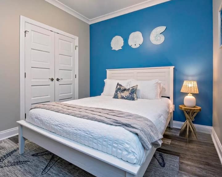 Bedroom 2 with queen size bed, closet, dresser and Smart TV