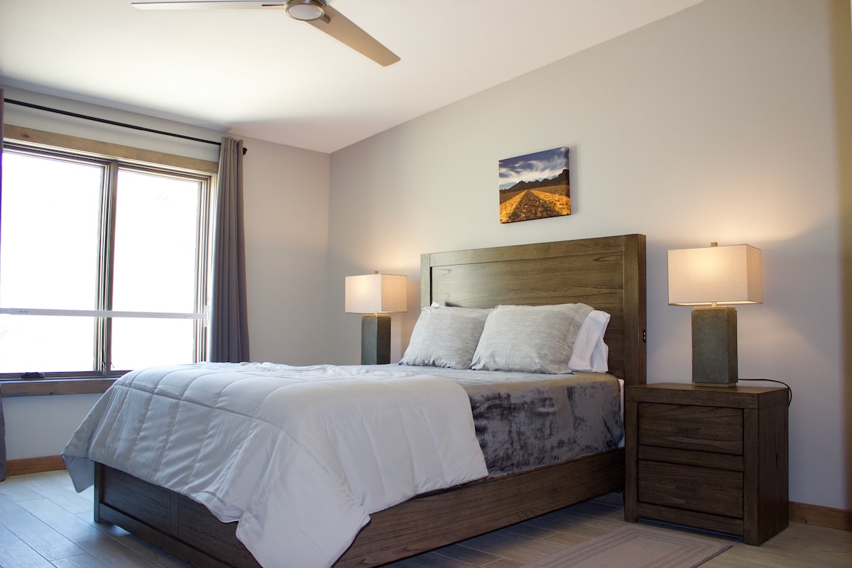 A second queen bedroom also located on the third floor in the traditional part of the home above the Boeing 727 aircraft. 