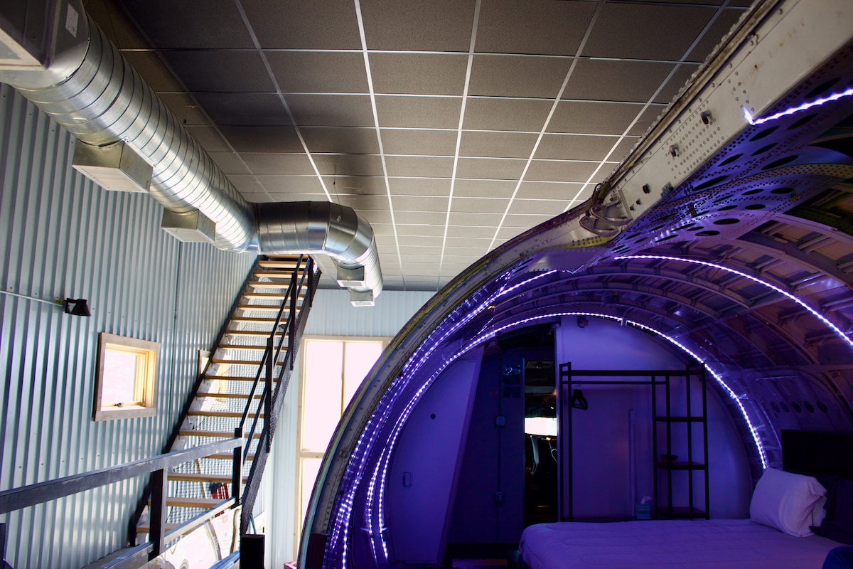 This three-story home features three traditional bedrooms upstairs, along with a bedroom on the main deck of the aircraft, just next to the fully intact cockpit.