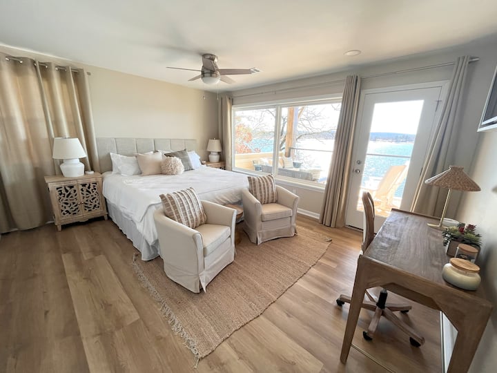 Upstairs primary suite with king bed and desk