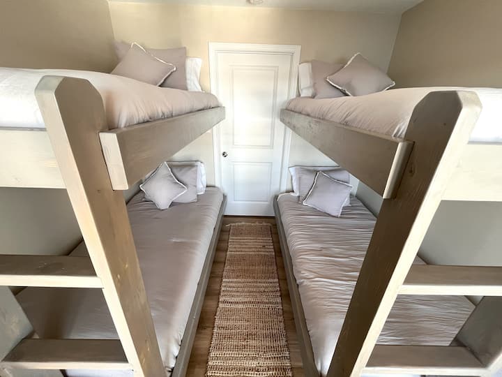 Bunk room with two sets of twin bunks
