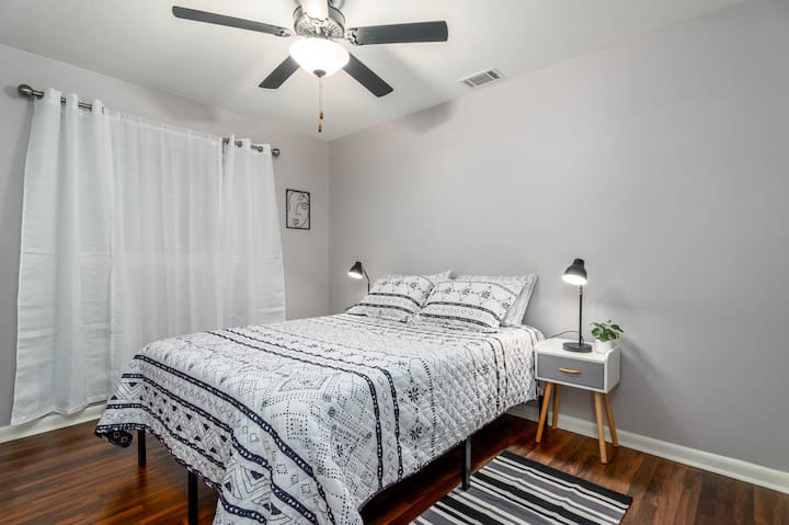 Bedroom 3: Queen size bed and a night stand.