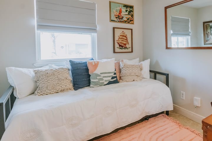 Bedroom with trundle twin beds and dedicated work space 
