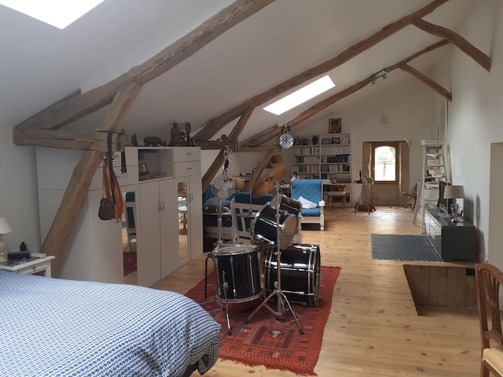 Large 60 m2 bedroom on the half floor, with its small TV lounge