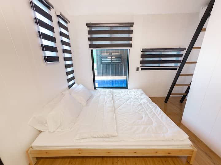 Each cabin has two (2) single bed in the ground floor which can be moved together for a bigger bed space.