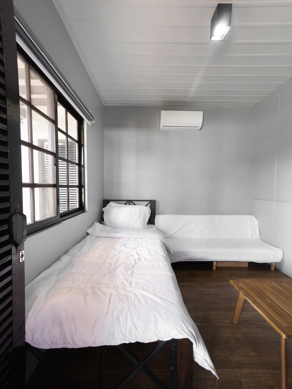 This is the entertainment room convertible to extra bedroom. It has single bed and sofa bed