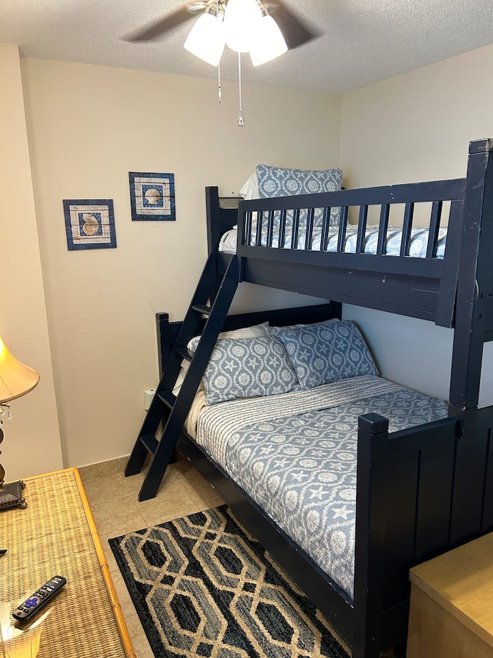 Full bed on the bottom and single on the top! Great kids room - sleeps 3 in this room! Newly installed ceiling fan as well