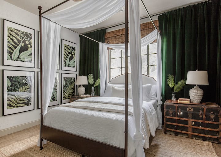 Primary bedroom with ensuite bathroom. Offering Queen accommodations in a gorgeous and comfortable canopy bed.