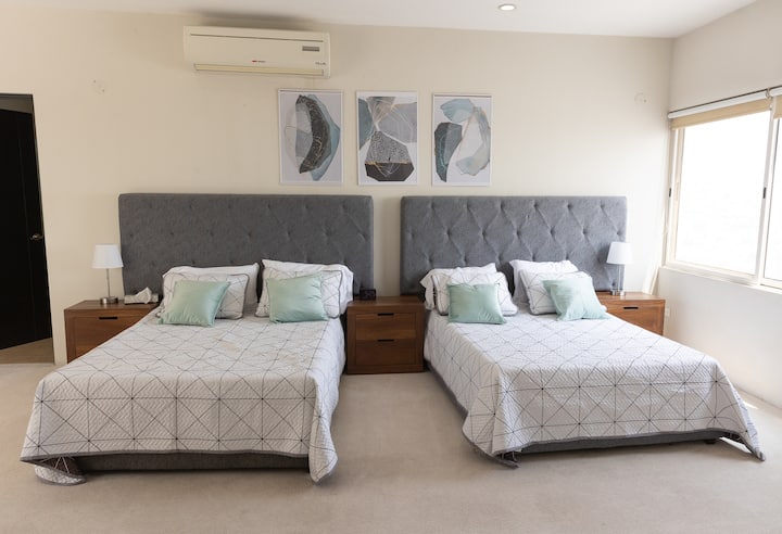 Private room with two double beds.