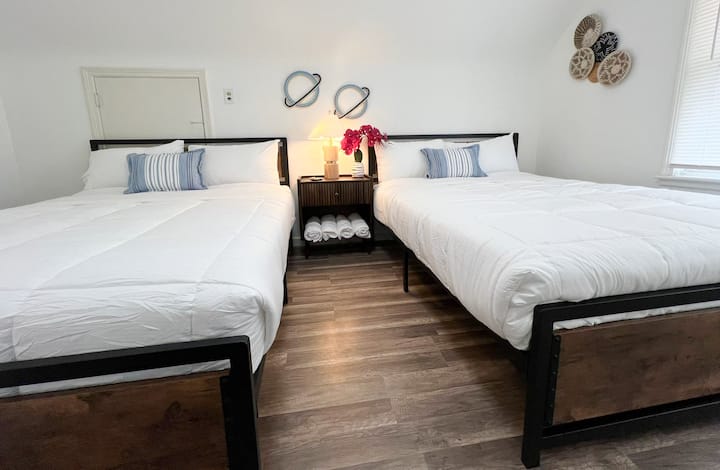 Double the comfort, double the fun! Bedroom 2 boasts two queen-sized beds, ready to welcome a dream team of four. Perfect for friends or family wanting to share sweet dreams and wake up refreshed!