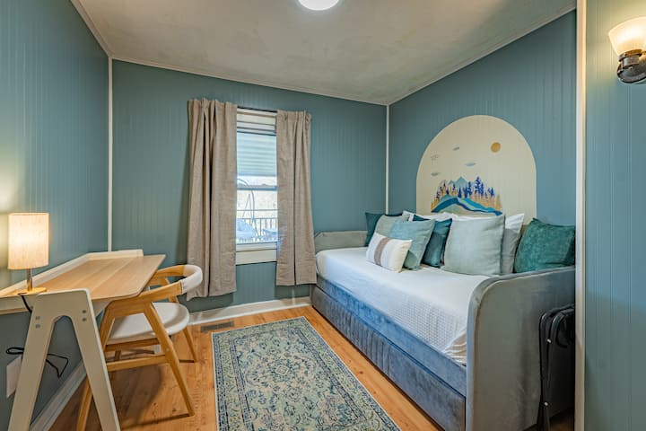 Office space by day. Two twin beds by night. 