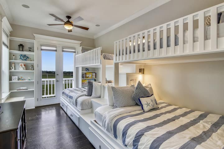 Bunk bedroom with two queen beds and two single beds. Perfect space for the kids with plenty of room for play and a lot of board games!