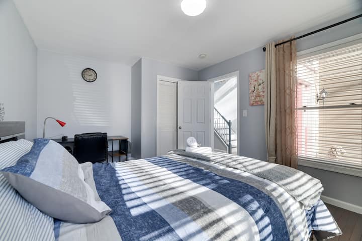 Downstairs bedroom with a queen-sized bed.