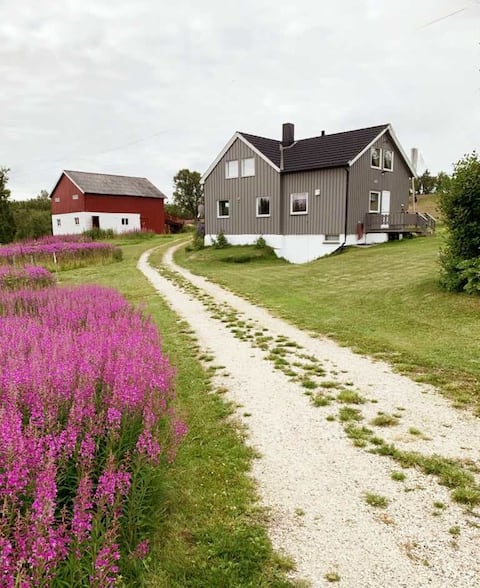 Farmhouse in peaceful cultural landscape with lake view