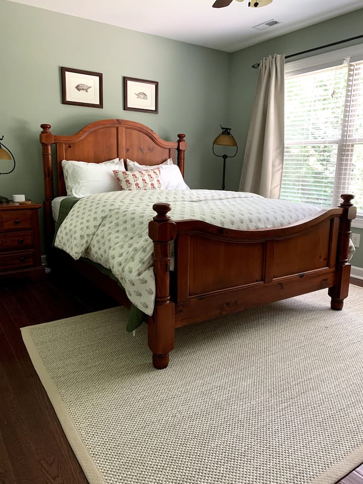 This is the first of the two upstairs guest rooms, both with queen beds. USB/USB-C portable charging station and sound machine provided.