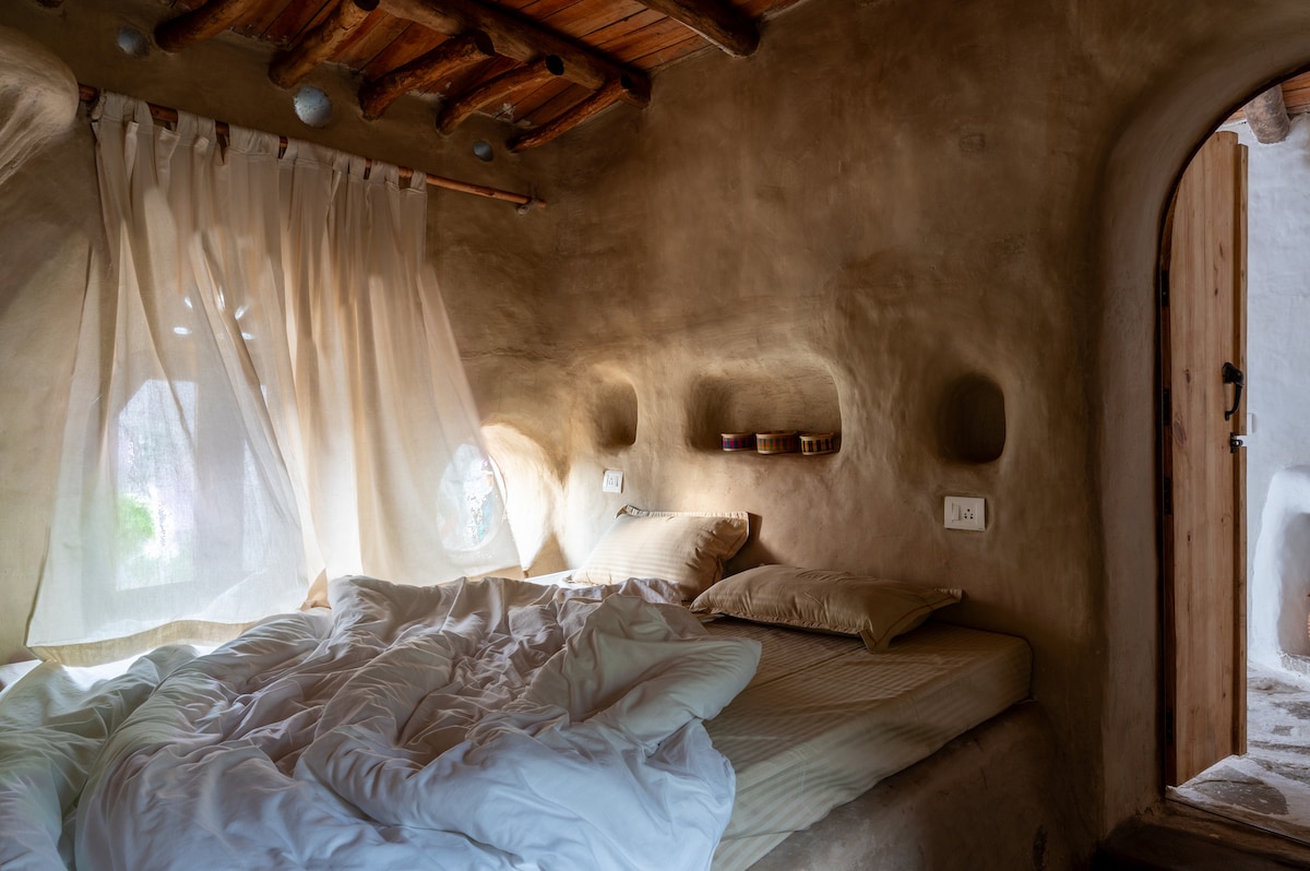 It is designed as a tiny house and hence there is no separate door to the bedroom.