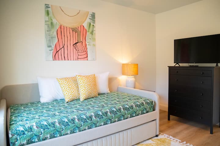 Trundle bed that houses two twins with Smart TV