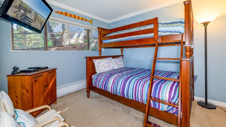 Full size bed on the bottom with a Twin size bed on top.