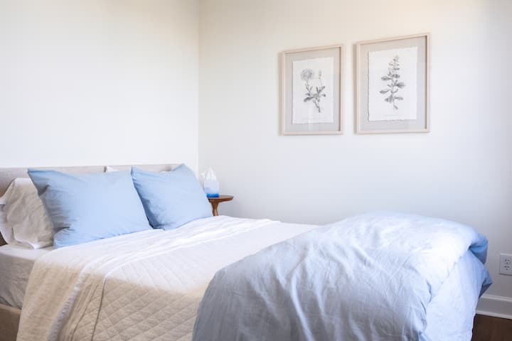The second bedroom features a queen size bed with lots of great light and peaceful surroundings
