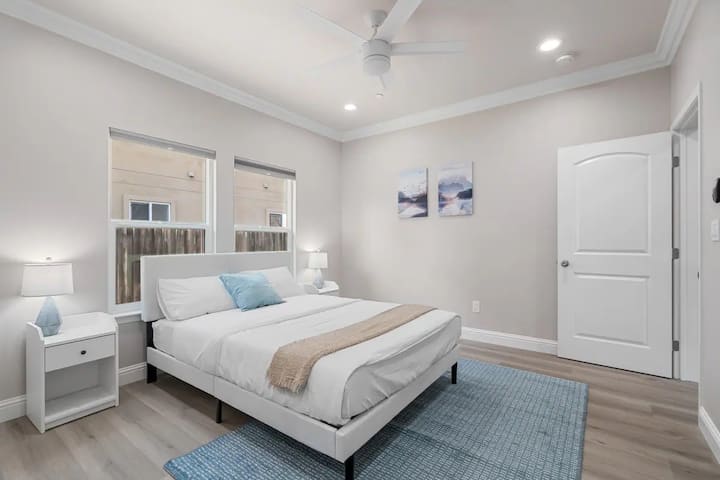 The bedroom offers a luxurious retreat, with a bed that promises restful nights and a room that feels like a private oasis.