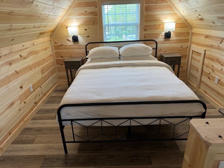 Queen size bed in stand-up loft.