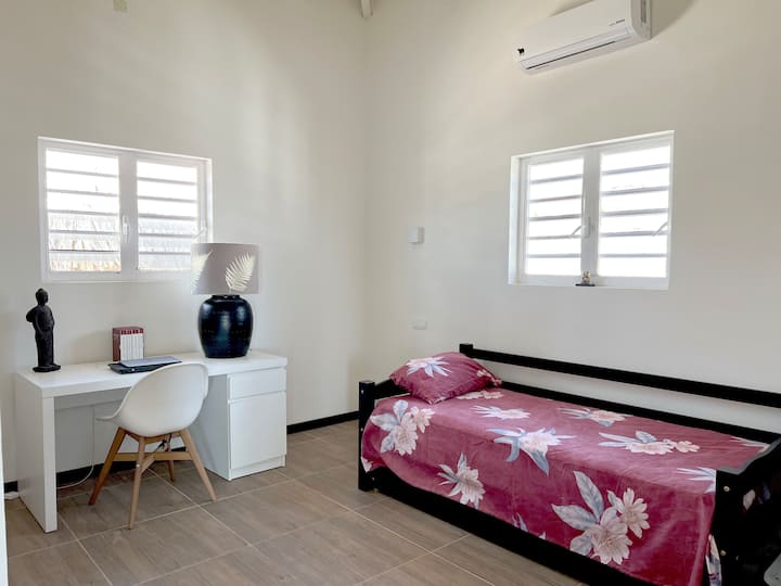 The bottom of the bed slides out to form two twin-sized beds.