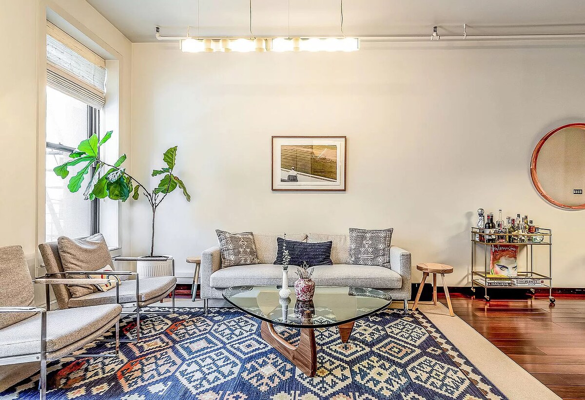 Loft home with an exposed brick wall and a dark oak kitchen