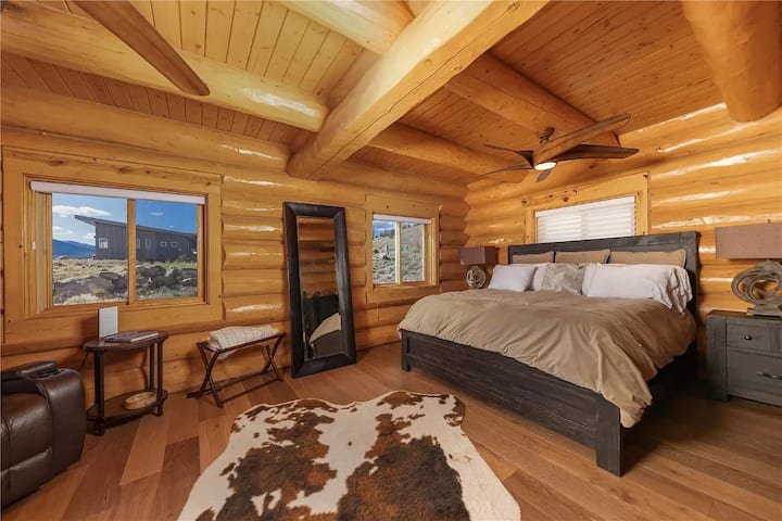 Main floor primary room with king bed and desk space