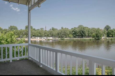 House on the water with garden and pool